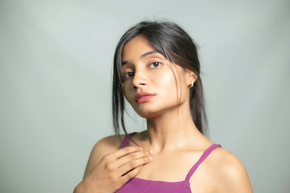 A woman with smooth, glowing skin on her shoulders